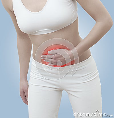 Acute pain in a woman abdomen Stock Photo