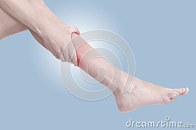 Acute pain in a woman calf Stock Photo