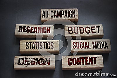 AD CAMPAIGN research budget statistics social media design conctent words on wooden blocks. Marketing advertising concept Stock Photo