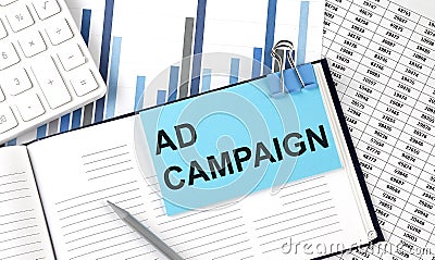 AD CAMPAIGN text on blue sticker on the chart background near calculator Stock Photo