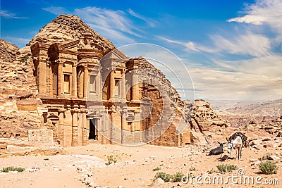 Ad Deir or Monastery, ancient Nabataean stone carved temple, with donkeys in the foreground, Petra, Jordan Editorial Stock Photo