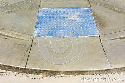 ADA compliant detectable warning surface tactile paving installation on intersection pedestrian crossing Stock Photo