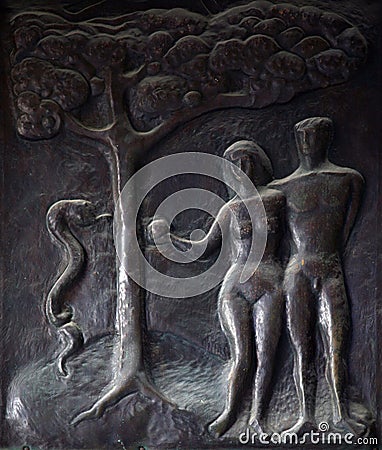 Adam and Eve, Illustrations of stories from the Bible on doors Basilica of the Annunciation in Nazareth Stock Photo