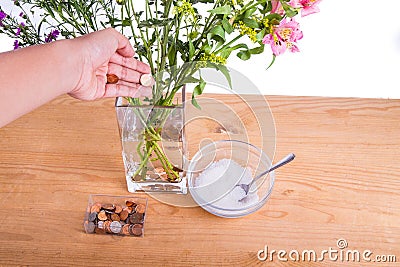 Add copper coins and sugar into vase keep flowers fresher Stock Photo