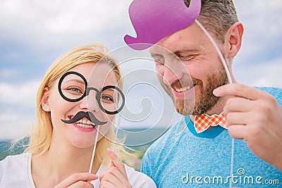 Add some fun. Making funny photos birthday party. Just for fun. Humor and laugh concept. Couple posing with party props Stock Photo