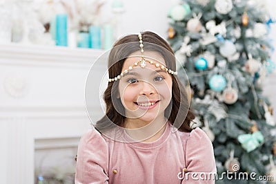 Add some glitz and glam to your look. Happy girl smile with Christmas look. New year eve party look of small child. Give Stock Photo