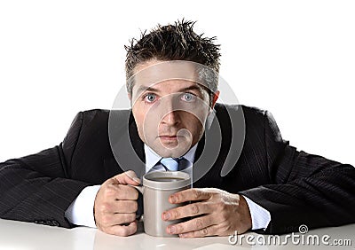 Addict businessman holding cup of coffee anxious and crazy in caffeine addiction Stock Photo