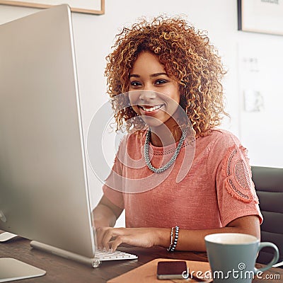 Addicted to bettering myself. a young designer working on her computer. Stock Photo