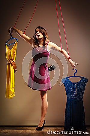 Addicted to shopping woman, marionette on string. Stock Photo