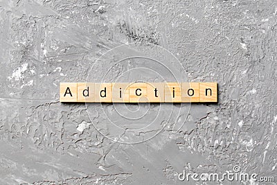 Addiction word written on wood block. Addictiontext on table, concept Stock Photo