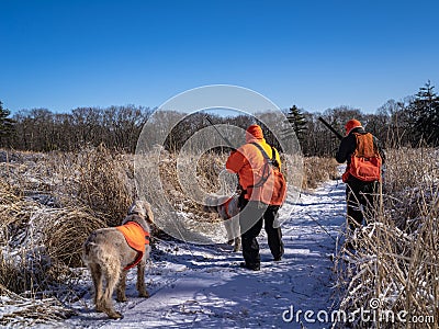 Two Hunters Wearing High Viz Clothing Wait For A Bird Editorial Stock Photo