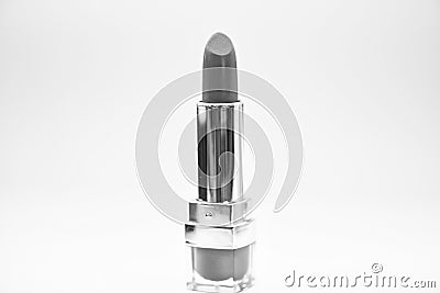 Adding some shine to lips. Lip care concept. Lipstick on white background. Water resistant high quality lipstick product Stock Photo
