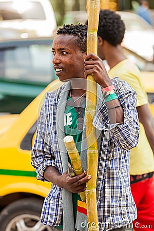 Man selling sugarcane on the street Editorial Stock Photo