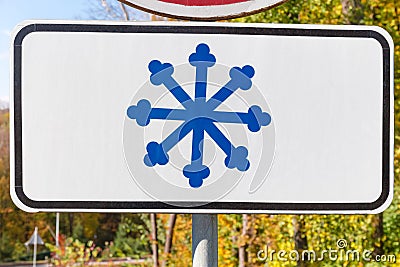 Additional road sign warns about risk of snow and ice Stock Photo