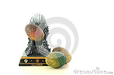 Games of Thrones HBO authorized replica of the Iron Throne with dragon eggs. Editorial Stock Photo