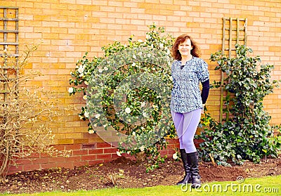 Adele amongst the camelias, in March. Stock Photo