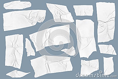 Adhesive tape pieces on blue background. Masking paper tape torn and wrinkled pieces set Stock Photo