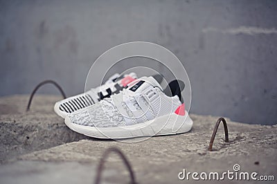 Adidas Equipment EQT Support running shoes, sneakers on grey background. Krasnoyarsk, Russia - December 12, 2017 Editorial Stock Photo