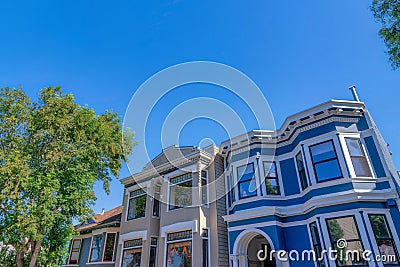 Adjacent middle class homes with decorative trims and bay windows at San Francisco, California Stock Photo