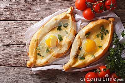 Adjarian khachapuri and vegetables horizontal top view Stock Photo