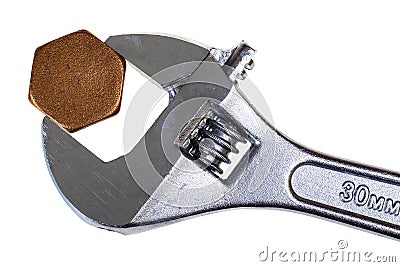 Adjustable wrench and hexagonal cap Stock Photo