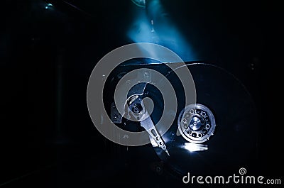 Adjustable wrench turn off a hard disk. On a dark background. Computer repair concept Stock Photo