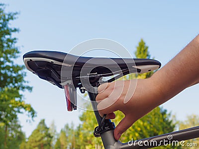 Adjusting A Bicycle Seat Stock Photo