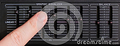Adjusting the sound frequency balance using equalizer faders Stock Photo
