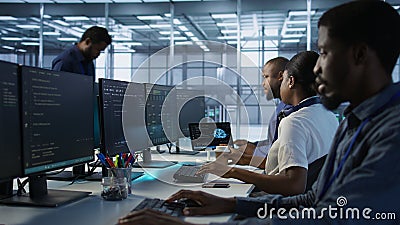 Admin in data center drinking coffee and implementing AI systems Stock Photo