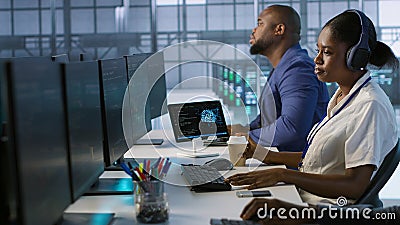 Admin in data center drinking coffee and implementing AI systems Stock Photo