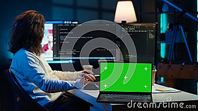 Admin using green screen laptop to implement security measures Stock Photo