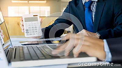 Administrator business man financial inspector and secretary making report, calculating or checking balance. Internal Revenue Stock Photo