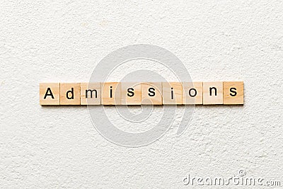 admissions word written on wood block. admissions text on table, concept Stock Photo