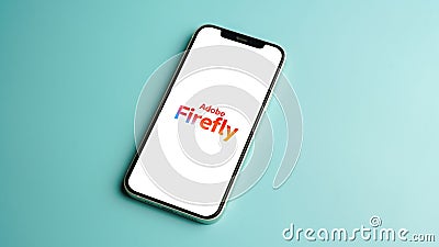 Adobe Firefly logo displayed on mobile phone screen, AI Art generator tool Editorial Stock Photo