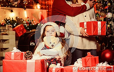 Adopting child. Christmas memories. Happy moments. Girl at home on christmas eve. Kid celebrate new year with pile of Stock Photo