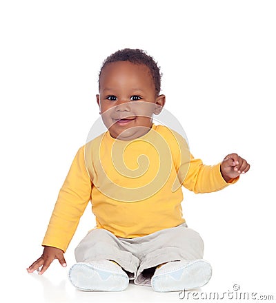 Adorable african baby sitting on the floor Stock Photo