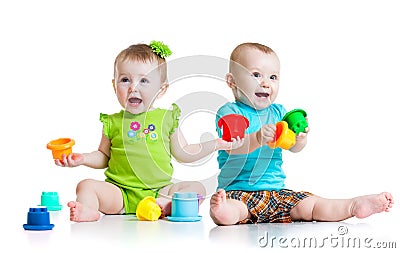 Adorable babies playing with color toys. Children Stock Photo