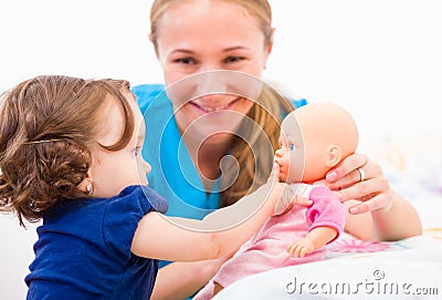 Adorable baby and babysitter Stock Photo