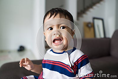 Fussy baby with snots dripping on his face stock photo Stock Photo