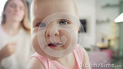 Adorable baby face looking in camera. Portrait of happy child exploring world Stock Photo