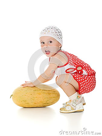 An adorable baby happily playing melon Stock Photo