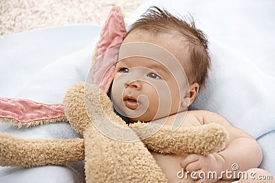 Adorable baby with plush bunny Stock Photo