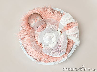 Adorable baby swaddled with white blanket, topview Stock Photo