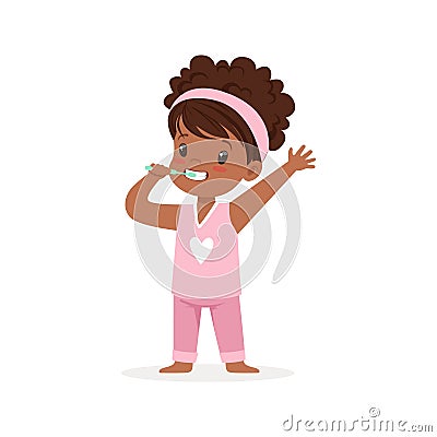 Adorable black cartoon girl in a pink pajamas brushing her teeth, kids dental care vector Illustration Vector Illustration