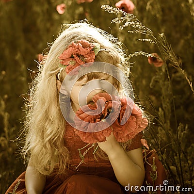 Adorable blond girl with red poppies Stock Photo