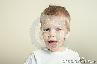 Adorable blond toddler laughing Stock Photo