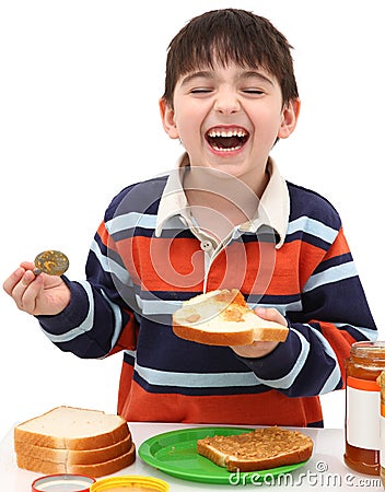 Adorable Boy Making Peanutbutter Sandwich Stock Photography