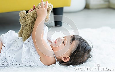 Adorable caucasian little baby daughter kid girl, laughing, smiling with happiness, good health, relax day sleeping, laying down Stock Photo