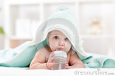 Adorable child baby drinking water from bottle Stock Photo