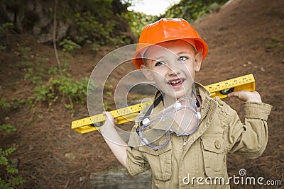 Adorable Child Boy with Level Playing Handyman Outside Stock Photo